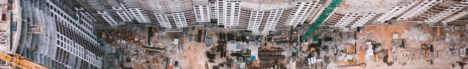 Birds-eye view of an engineering site among highrise buildings